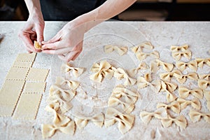 Unrecognizable cook making farfalle