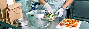 Unrecognizable cook preparing takeaway orders