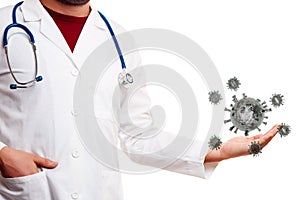 Unrecognizable doctor in white coat holds coronavirus in palm of his hand on white background