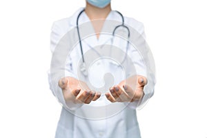 Unrecognizable female doctor holding some invisible items with both hands