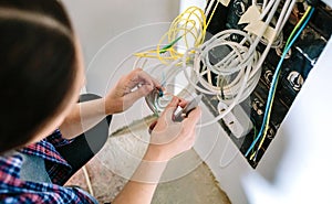 Unrecognizable female technician installing lan network