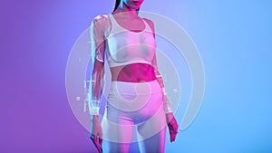 Unrecognizable Fitness Lady With Perfect Body Standing On Neon Background