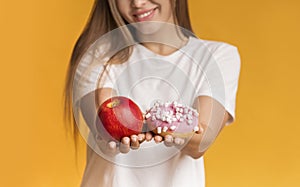 Unrecognizable Girl Holding Apple And Doughnut Offering Healthy And Unhealthy Food