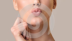 Unrecognizable Girl Pouting Lips Posing Over Beige Background, Panorama, Cropped