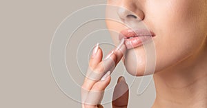 Unrecognizable Girl Touching Lips Over Beige Studio Background, Panorama, Cropped