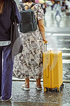 Unrecognizable girl traveling with suitcase, travel and tourism