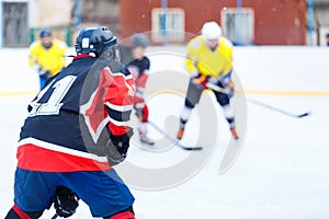 Ice hockey game on rink