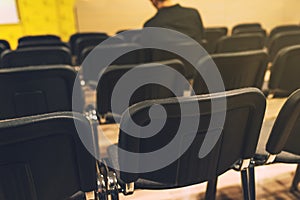 Unrecognizable journalist in press conference room