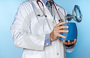 unrecognizable male doctor holding a hand-held resuscitator photo
