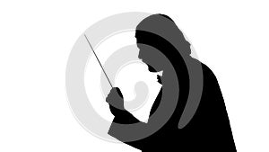 Unrecognizable man conductor silhouette on white background