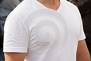 Unrecognizable man dressed white t-shirt. Template for your design. Half-turn. Closeup