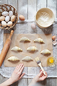 Unrecognizable man hands prepare dough for croissant sweet dessert