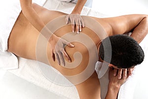 Unrecognizable man receiving massage relax photo