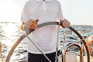 Unrecognizable man standing on a yacht