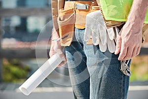 Unrecognizable man with toolbelt