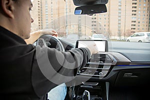 unrecognizable man use empty touchscreen display with copyspace. modern technologies, driving and parking safety. Close up,