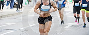 Unrecognizable muscular runner outdoors. Long distance running. Blue color