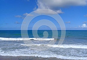 Unrecognizable people surfing and bodyboarding in the waves