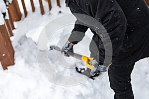 Unrecognizable person shoveling the snow