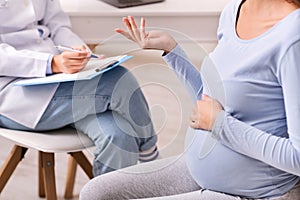 Unrecognizable Pregnant Woman Talking With Therapist In Office, Cropped