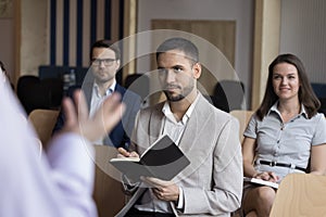 Unrecognizable presenter make speech standing in front of participants