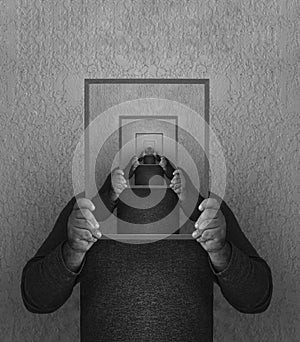 unrecognizable same mens in perspective holding behind head white blank picture photo frame. males holding mirror frame with
