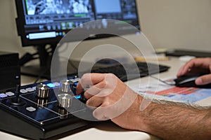 Unrecognizable scientist working with scanning electron microscope