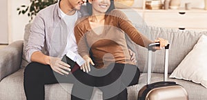 Unrecognizable Spouses Sitting With Packed Suitcase On Couch, Panorama, Cropped