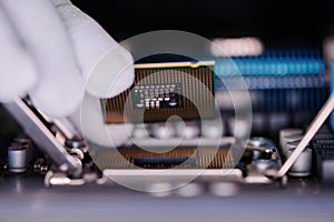 Unrecognizable Technician Installing New CPU Into Computer