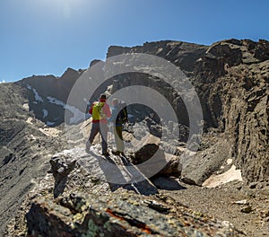 Unrecognizable tourists standing on rock