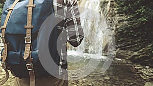 Unrecognizable Traveler With Backpack Reached His And Stands On Waterfall Background Closeup Hiking Journey Travel Trek Concept