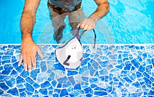 Unrecognizable water polo player in a swimming pool.