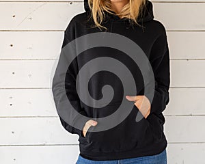 Unrecognizable woman in black hoodie