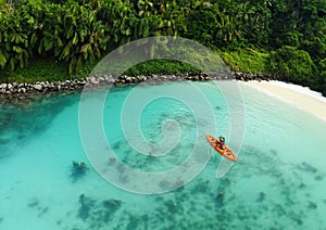 Unrecognizable Woman Canoeing in a Tropical Exotic Destination. Aerial Perspective of an Unrecognizable Tourist