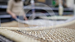 unrecognizable woman in carpet store blurred background