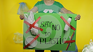 Unrecognizable woman holding protesting poster Say No To Plastic. Environment plastic pollution