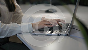 Unrecognizable woman office worker business female girl user businesswoman cropped view hands typing laptop keyboard