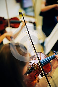 Unrecognizable woman playing the violin in public