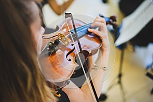 Unrecognizable woman playing the violin in public