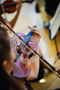 Unrecognizable woman playing the violin in public