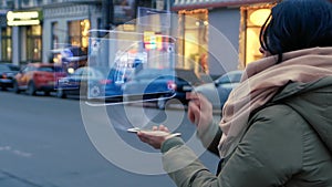 Unrecognizable woman standing on the street interacts HUD hologram with gun