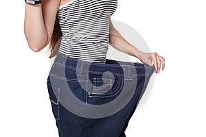 Unrecognizable woman torso, showing diet results isolated on whi