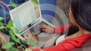 Unrecognizable woman typing on the computer.