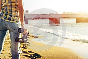 Unrecognizable Young Girl Standing On The Shore And Holding Binoculars, Rear View. Search Scout Travel Concept