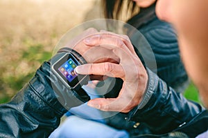 Unrecognizable young man using his smartwatch