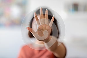 Unrecognizable Young Woman Covering Her Face With Open Palm, Showing Stop Gesture