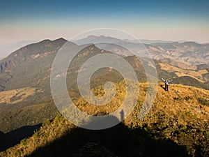 Unrecognized people on mountain summit trekking - freedom
