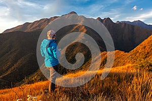 Unrecognized people using a celular smartphone in a mountain landscape