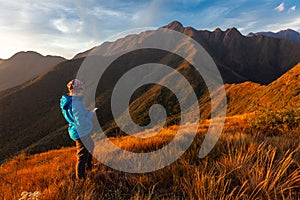 Unrecognized people using a celular smartphone in a mountain landscape