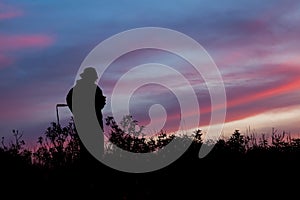 Unrecognized people using a celular smartphone in a mountain landscape